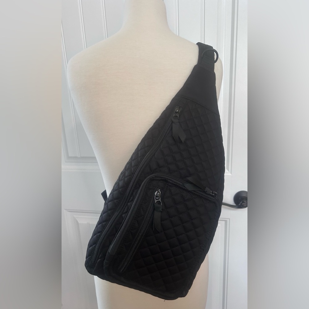Vera Bradley sling backpack.  Black in color.